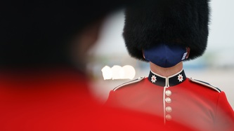 A member of the Royal Guard stands at attention