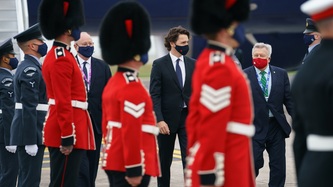 PM Trudeau walks down from the plane