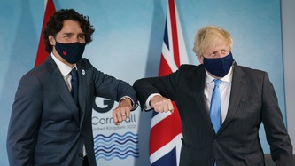PM Trudeau greets PM Boris Johnson with an elbow bump