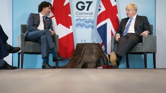 PM Trudeau sits with the PM of the United Kingdom, Boris Johnson
