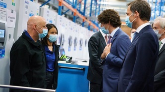Prime Minister Trudeau speaks with a man and a woman