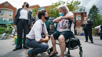 PM Trudeau chats with a woman in a wheelchair