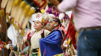 Two Cowessess First Nation children stand looking on