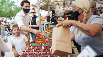 Prime Minister Trudeau and Hadrien buy fresh vegetables