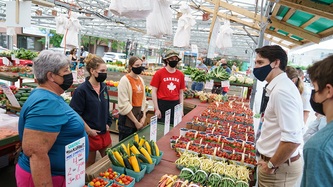 Prime Minister Trudeau talks with market vendors