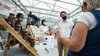 Prime Minister Trudeau talks with market vendors