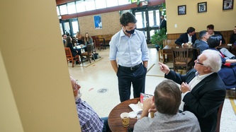 PM Trudeau speaks with a man