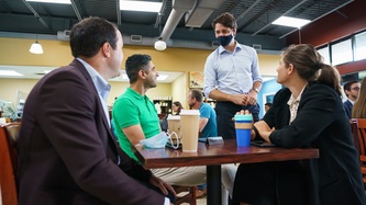 PM Trudeau speaks with a man