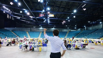 PM Trudeau waves at health workers