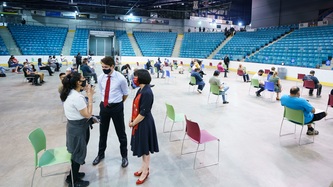 PM Trudeau and Minister Petitpas-Taylor speak with a woman