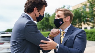 PM Trudeau and Premier Furey exchange an elbow bump