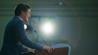PM Trudeau stands at a podium