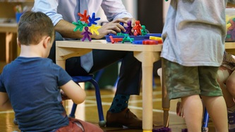 Children play at a small table