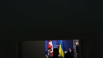 President Volodymyr Zelenskyy and Prime Minister Justin Trudeau sit and look to one another