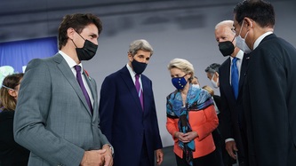 PM Trudeau stands with other dignitaries at COP26 