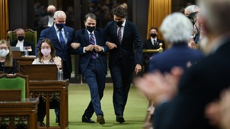 Conservative Leader Erin O'Toole and PM Trudeau hold Anthony Rota by the arms