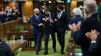 Conservative Leader Erin O'Toole and PM Trudeau hold Anthony Rota by the arms