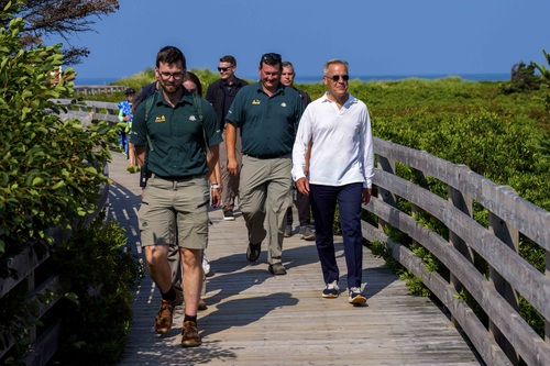 Prime Minister Mark Carney visits Prince Edward Island National Park and walks with Parks Canada employees and others.