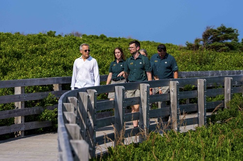 Prime Minister Mark Carney visits Prince Edward Island National Park and walks with Parks Canada employees.