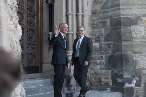 Prime Minister Mark Carney and Prime Minister Sir Keir Starmer arrive at West Block on Parliament Hill and wave to media. 