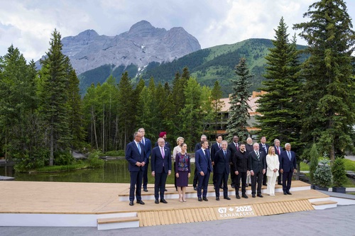 Prime Minister Mark Carney stands with G7 leaders, outreach countries and international organizations for a family photo. 