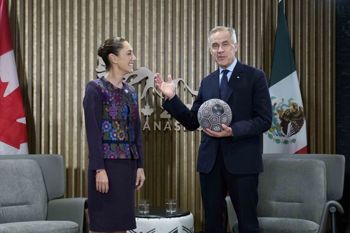 President Claudia Sheinbaum gifts a soccer ball to Prime Minister Mark Carney at the 2025 G7 Leaders' Summit.