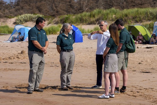 Prime Minister Carney visits Greenwich Beach in Prince Edward Island National Park and speaks with Parks Canada employees.