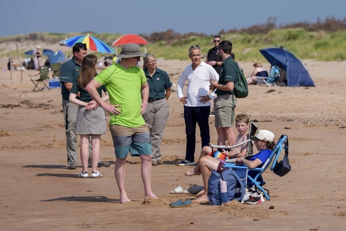 Prime Minister Carney visits Greenwich Beach in Prince Edward Island National Park and speaks with Parks Canada employees.