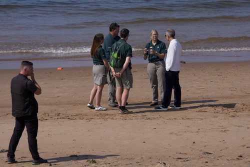 Prime Minister Carney visits Greenwich Beach in Prince Edward Island National Park and speaks with Parks Canada employees.