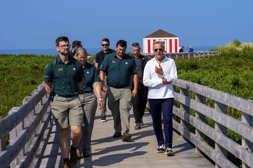 Prime Minister Mark Carney visits Prince Edward Island National Park and walks with Parks Canada employees and others.