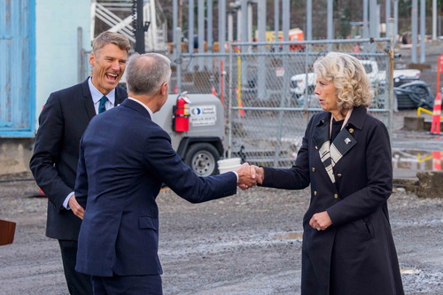 Prime Minister Mark Carney shakes hands with CEO of the Major Projects Office Dawn Farrell while Minister Gregor Robertson...