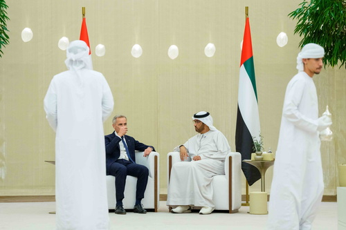 Prime Minister Mark Carney drinks tea as he meets with the Minister of Industry and Advanced Technology of the United Arab...
