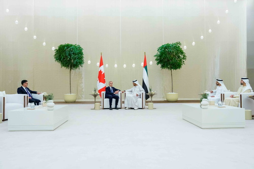 Prime Minister Mark Carney sits with UAE’s Minister of Industry and Advanced Technology, His Excellency Dr. Sultan bin Ahm...