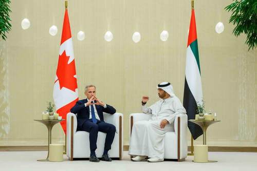 Prime Minister Mark Carney sits with UAE’s Minister of Industry and Advanced Technology, His Excellency Dr. Sultan bin Ahm...