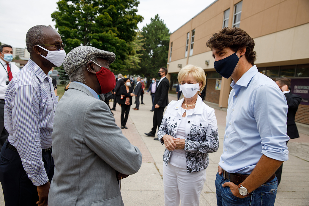PM Justin Trudeau and MP Judy Sgro speak with educators in Toronto
